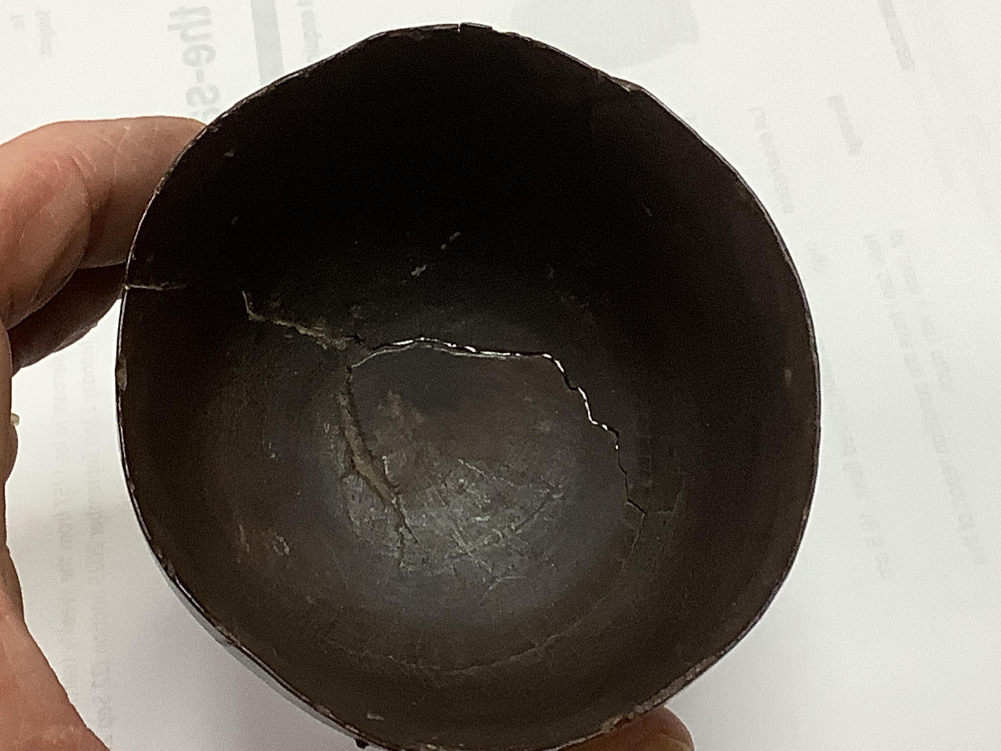 A 19th century or earlier engine-turned lignum vitae tumbler cup, engraved ‘Presented to M. S. Jones by a Friend 1843 AD 1701 +’, 6.5cm high, by repute found on the roof plate of Kenwood house London in 2012, during reno